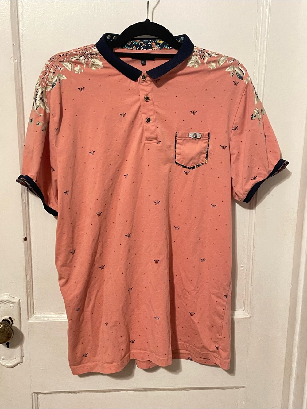 Men's Coral Polo with Navy Trim and Floral Shoulder Detail